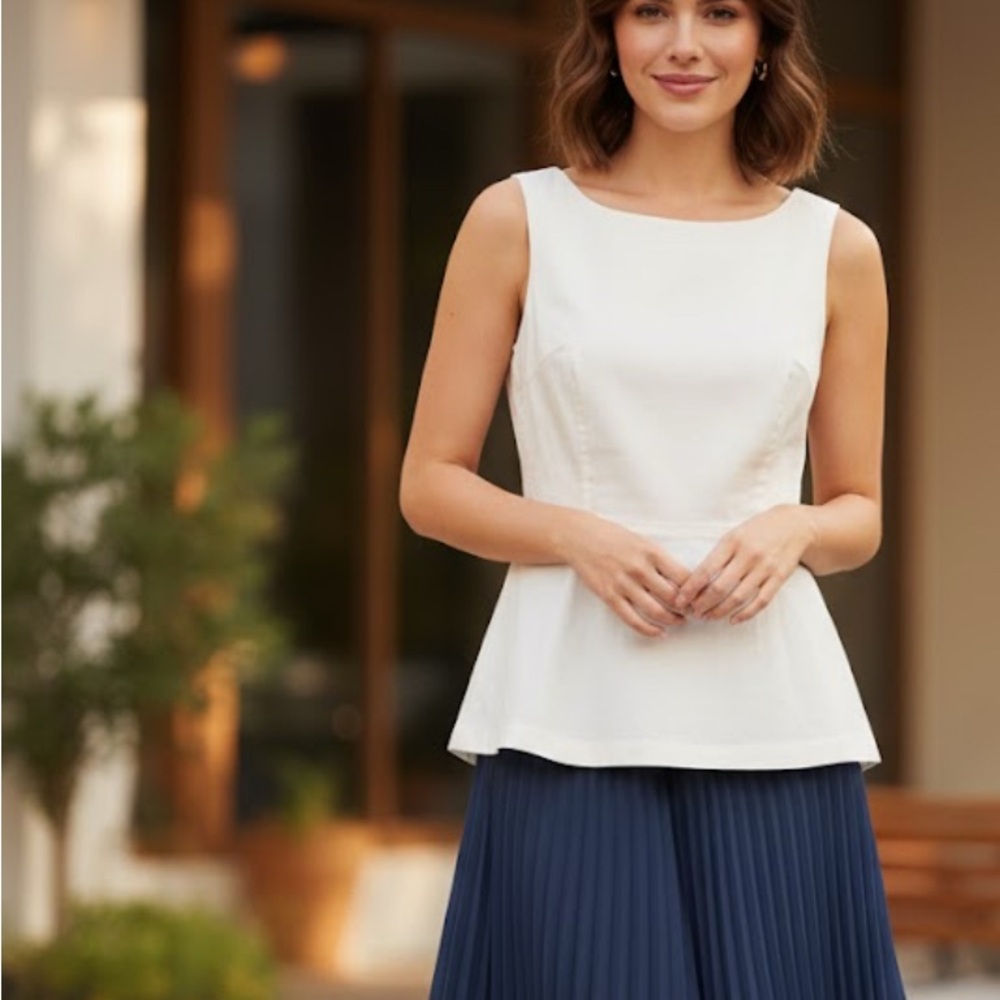 Elegant White Sleeveless Top with Navy Pleated Skirt